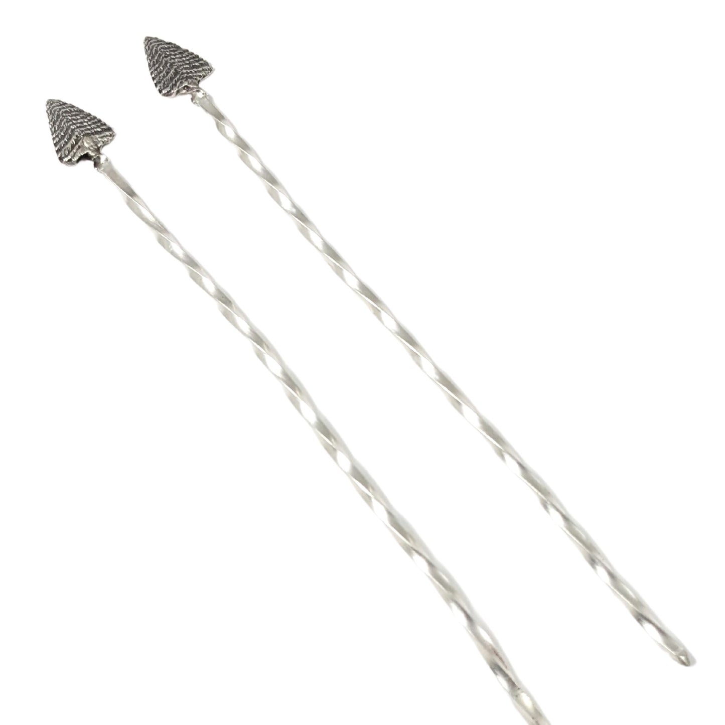 Pair of sterling silver cocktail picks. Evergreen trees set on a twisted silver wire.