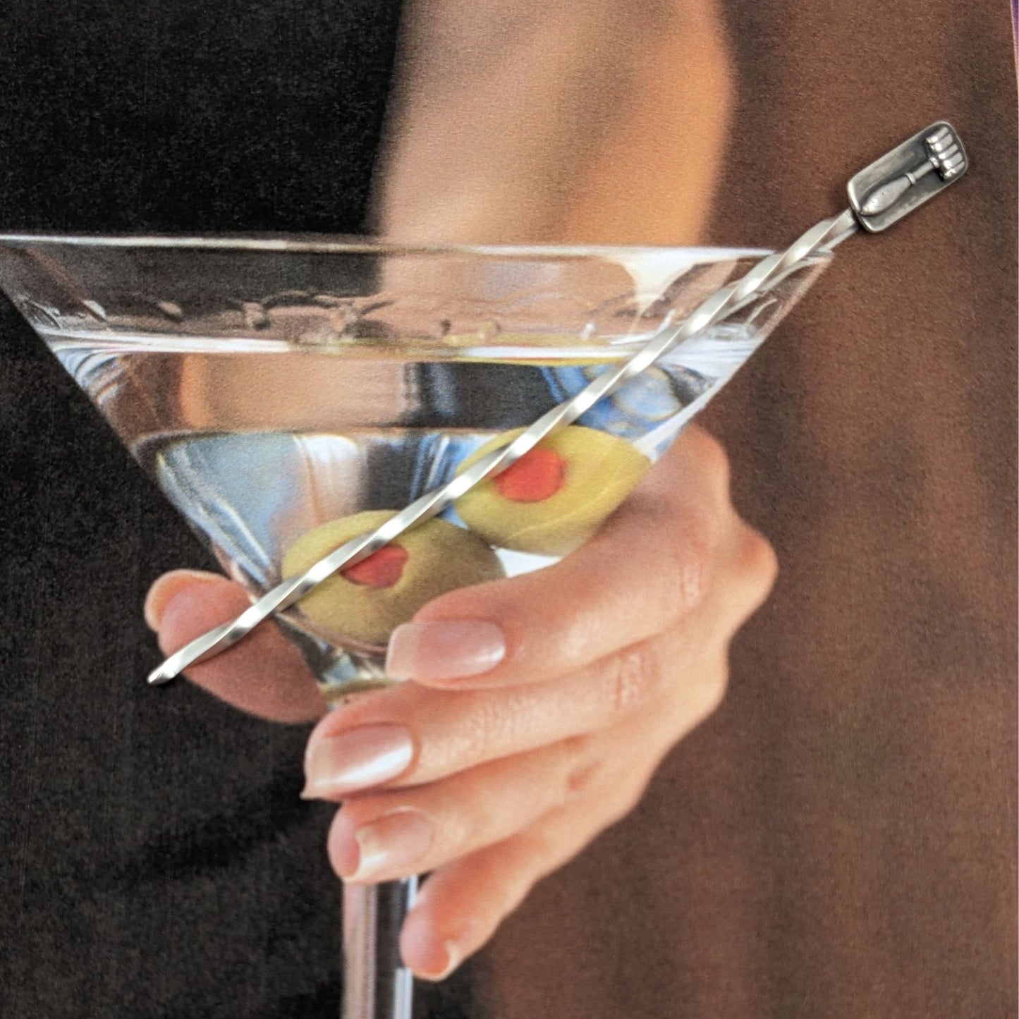 Sterling silver cocktail pick. One pick has the scales of justice at the top, the other has a gavel. Wire portion of the pick is twisted.