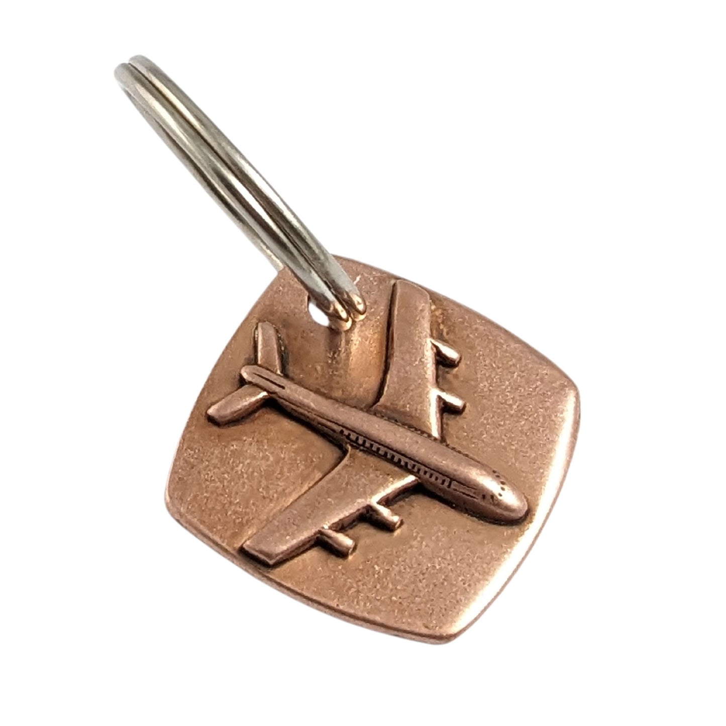 copper keychain with three dimensional passenger airplane