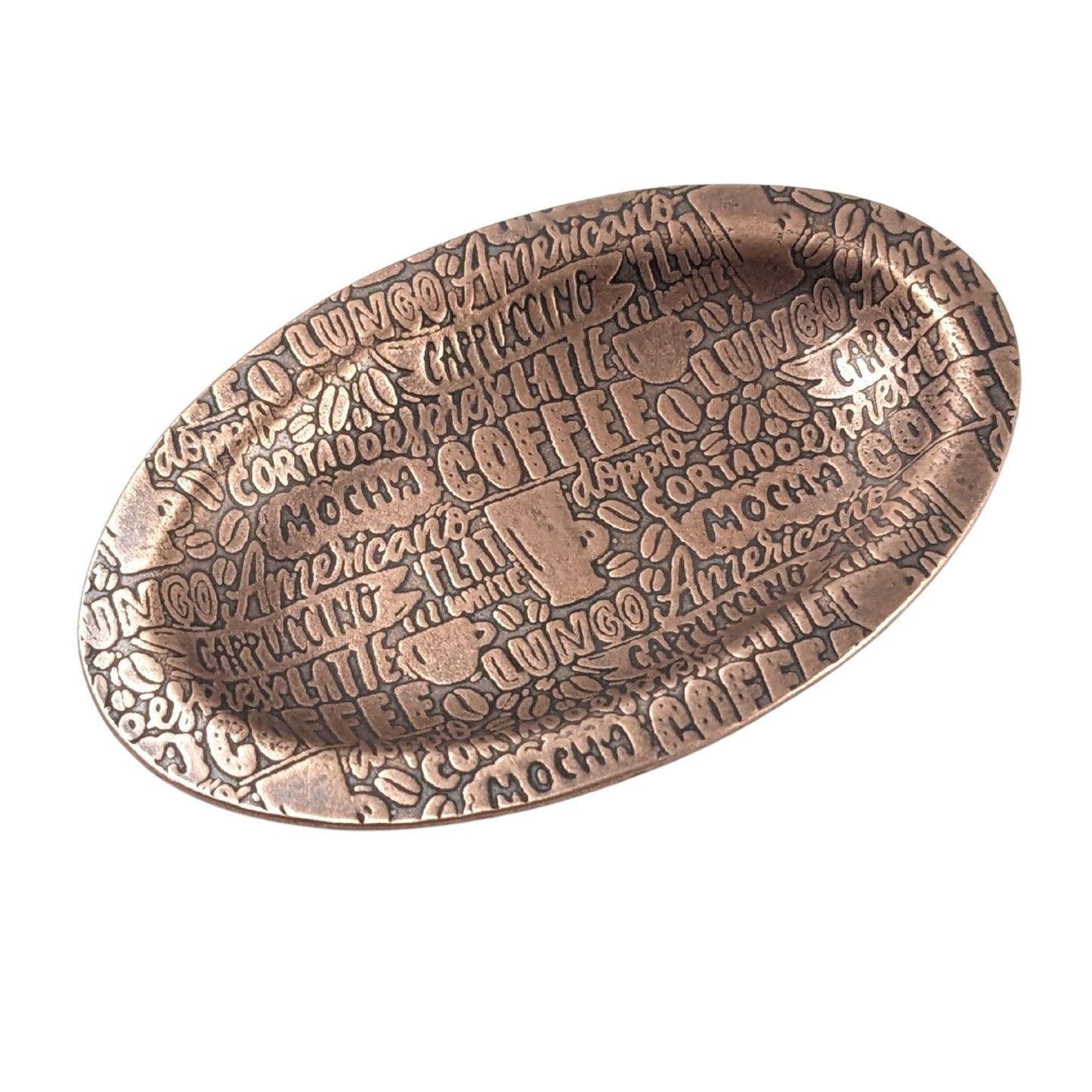 An oval copper ring dish with a raised edge. The dish has an impressed pattern of coffee order names.