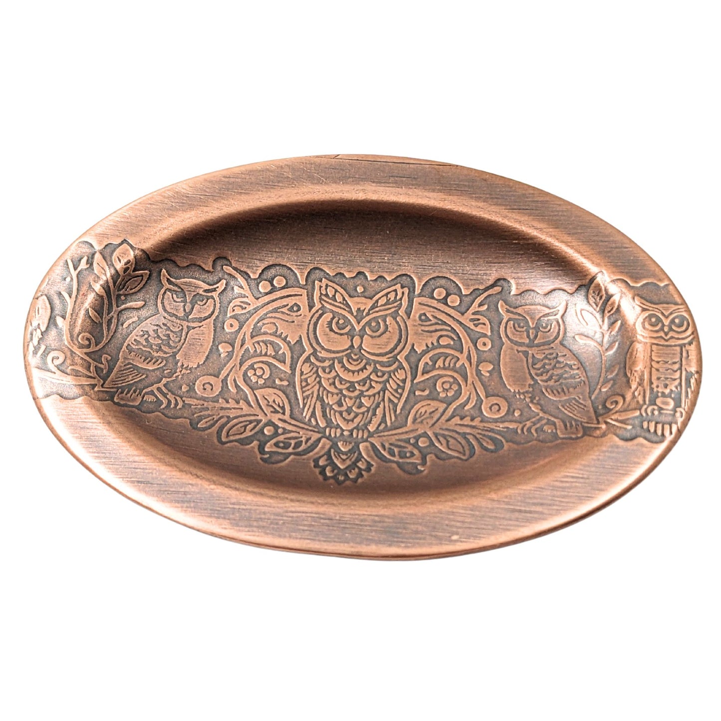 Oval copper ring dish with lip edge. Design across middle is one forward facing owl and one side facing owl on either side.