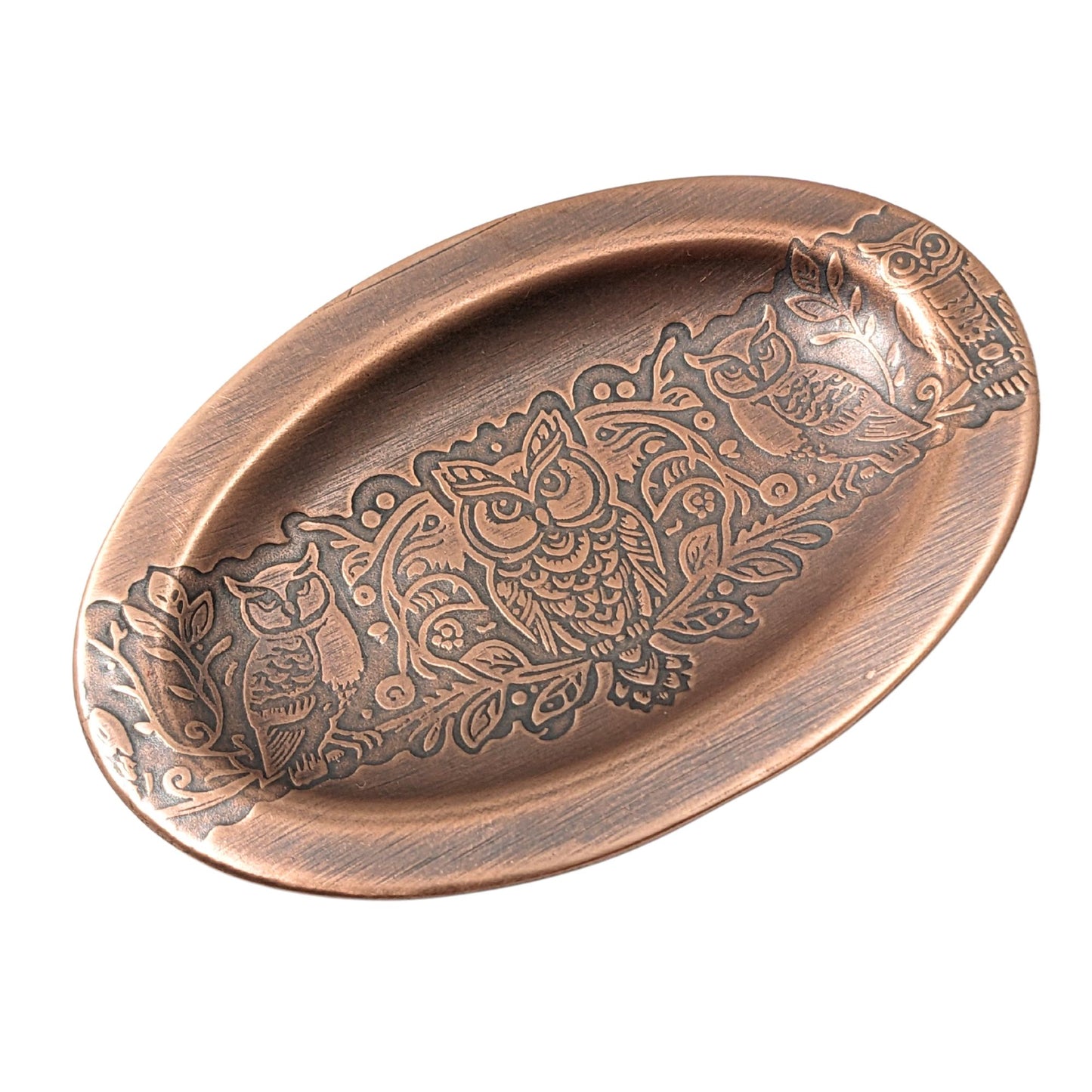 Oval copper ring dish with lip edge. Design across middle is one forward facing owl and one side facing owl on either side.