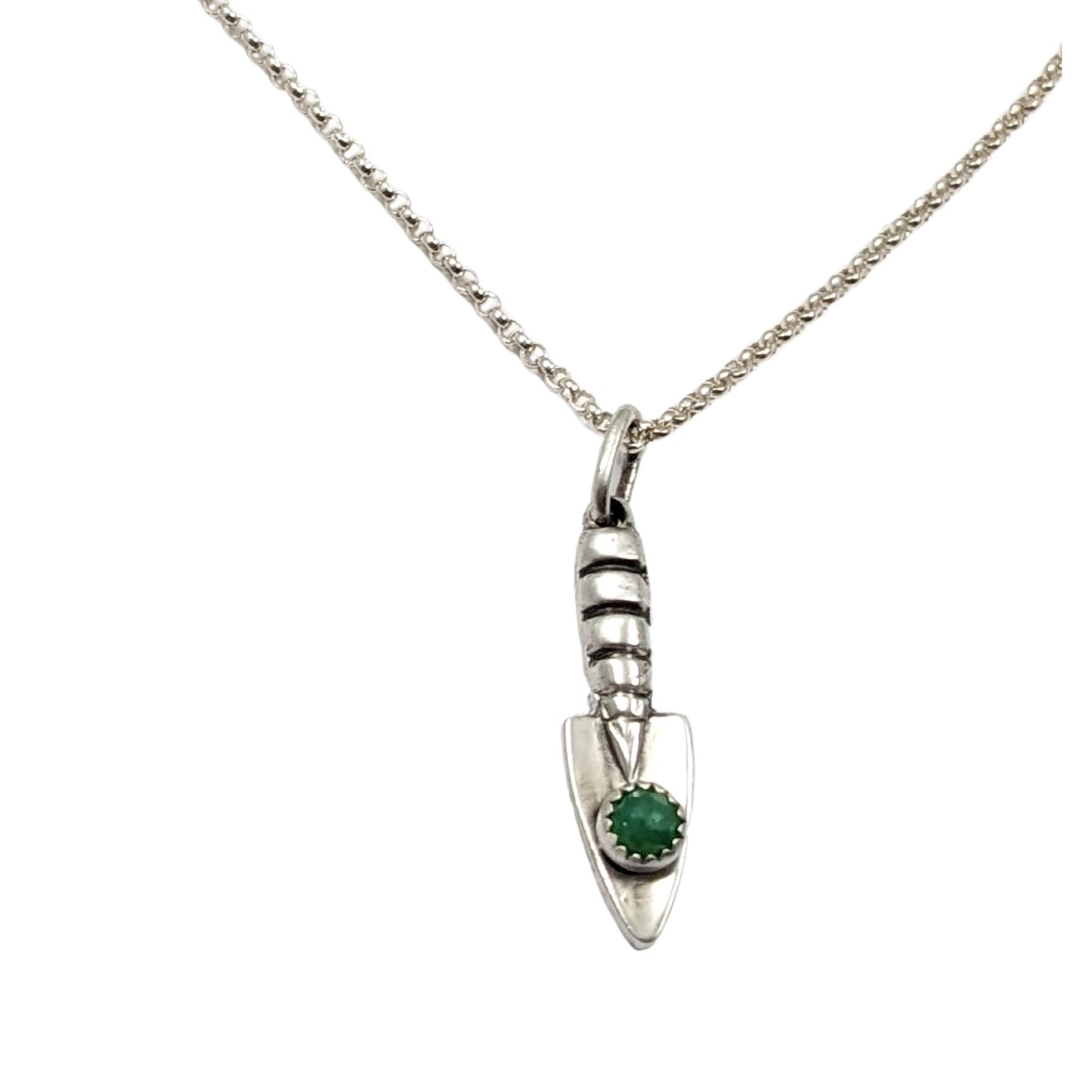 Three dimensional sterling silver garden hand trowel pendant with a faceted green chrysoprase gemstone on the trowel handle.