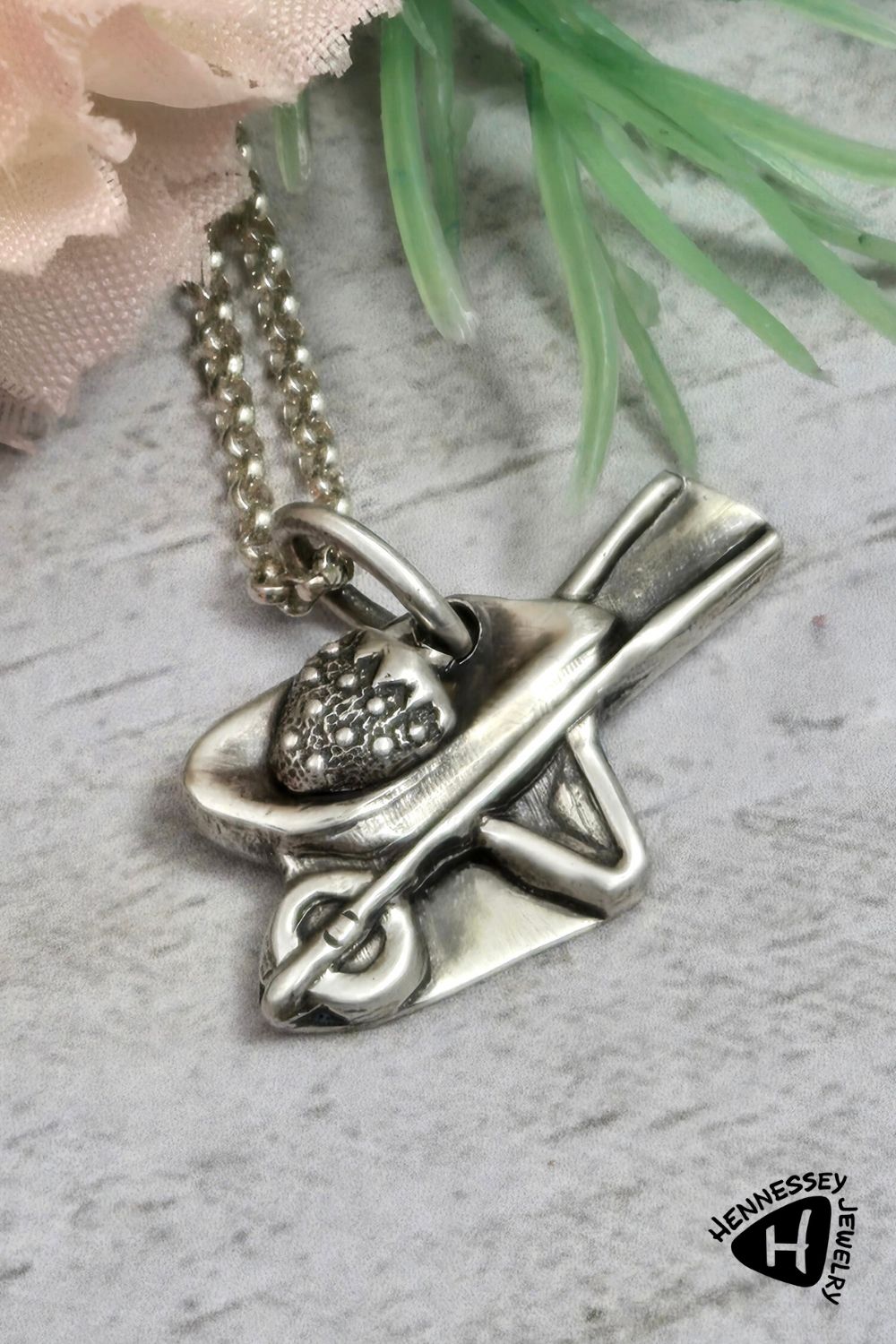 Sterling silver wheelbarrow pendant with a giant silver strawberry.
