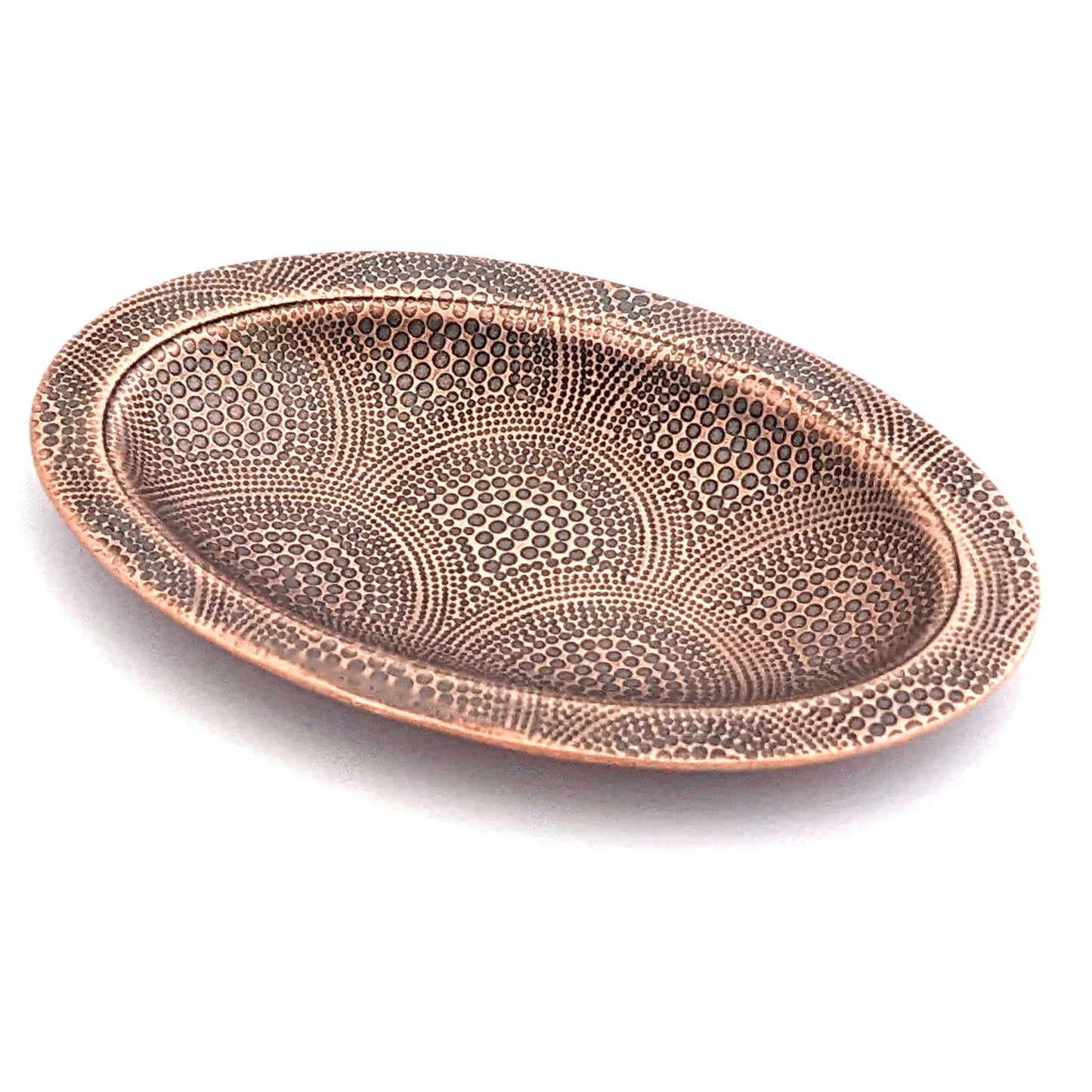 Copper oval ring dish with repeating pattern of dotted arches. Dish is 2 inches by three inches with a raised lip.