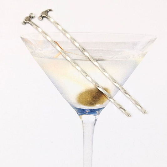 Sterling silver cocktail pick. One pick has a small ball peen hammer at the top, the other has a small claw hammer. Wire portion of the pick is twisted.