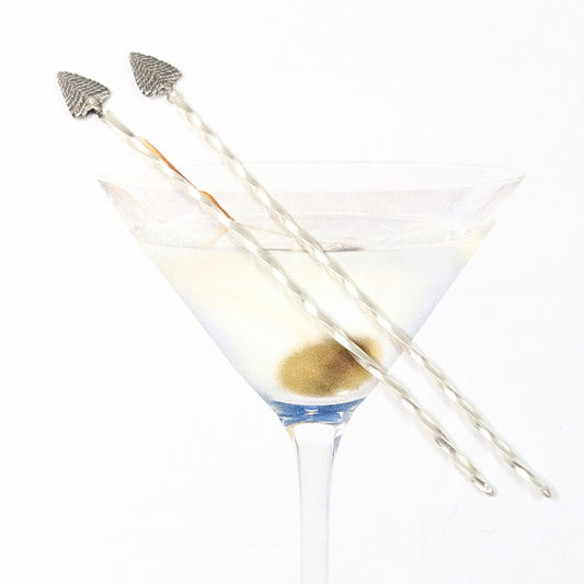 Pair of sterling silver cocktail picks. Evergreen trees set on a twisted silver wire.