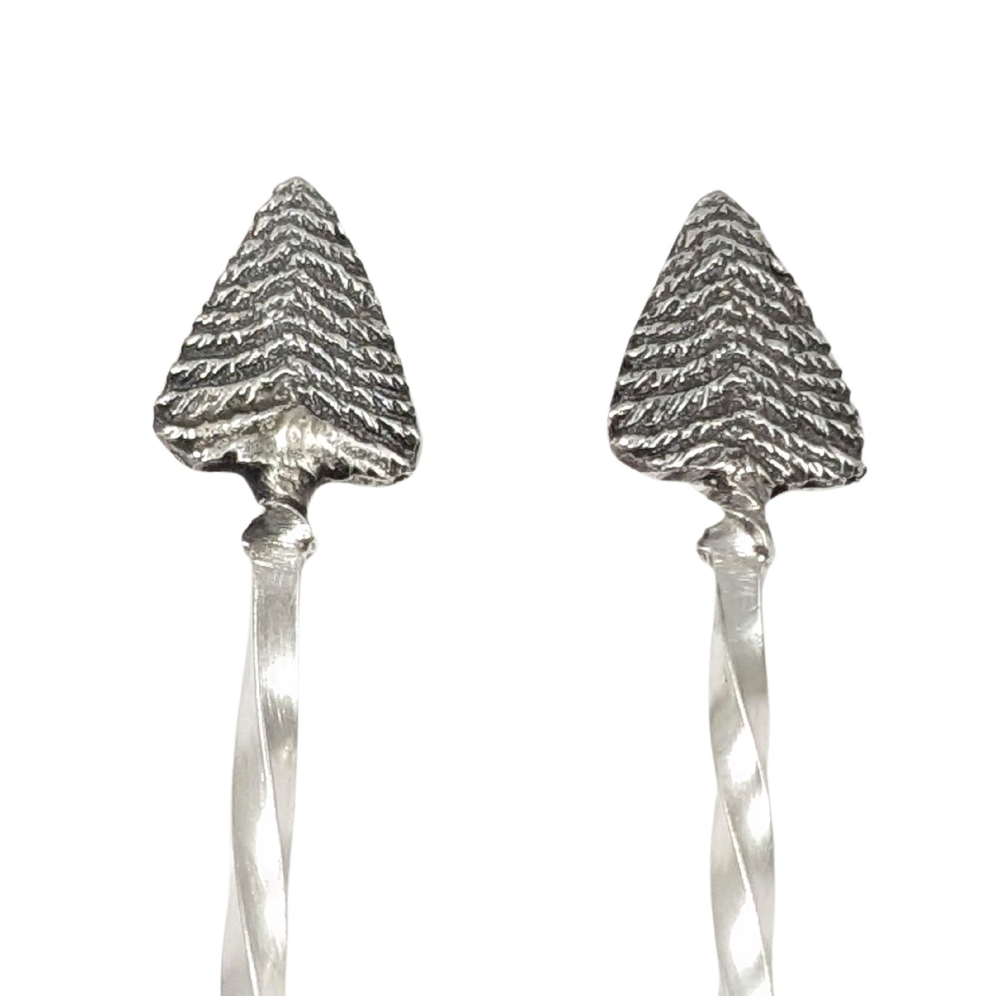 Pair of sterling silver cocktail picks. Evergreen trees set on a twisted silver wire.