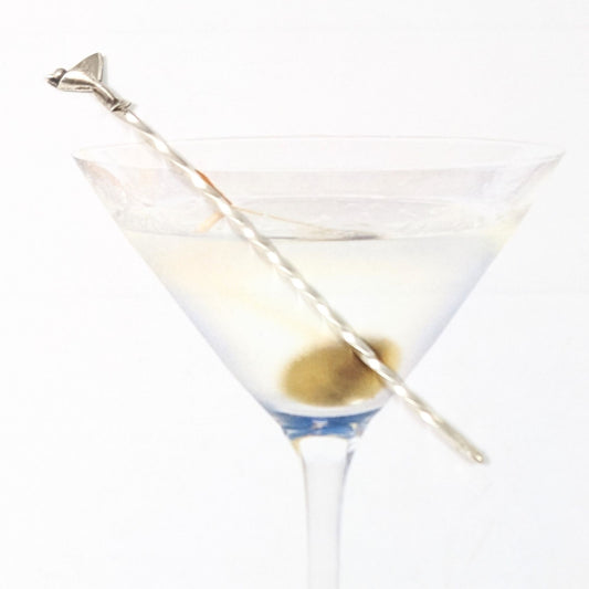 Sterling silver cocktail pick. At the top is a silver martini glass with a single olive.