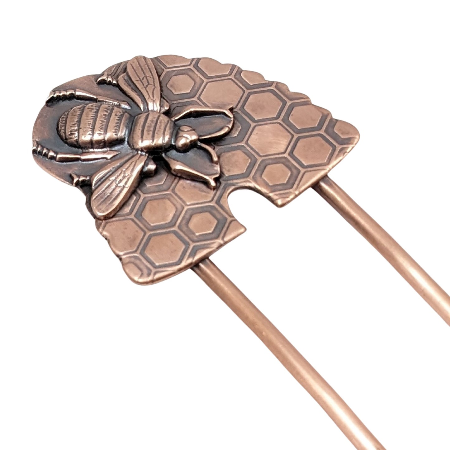 Copper Hair Fork with Bee and Beehive. The large beehive has a honeycomb design and the bee is very detailed and large enough to cover most of the hive. Recessed areas are darkened to highlight the details.