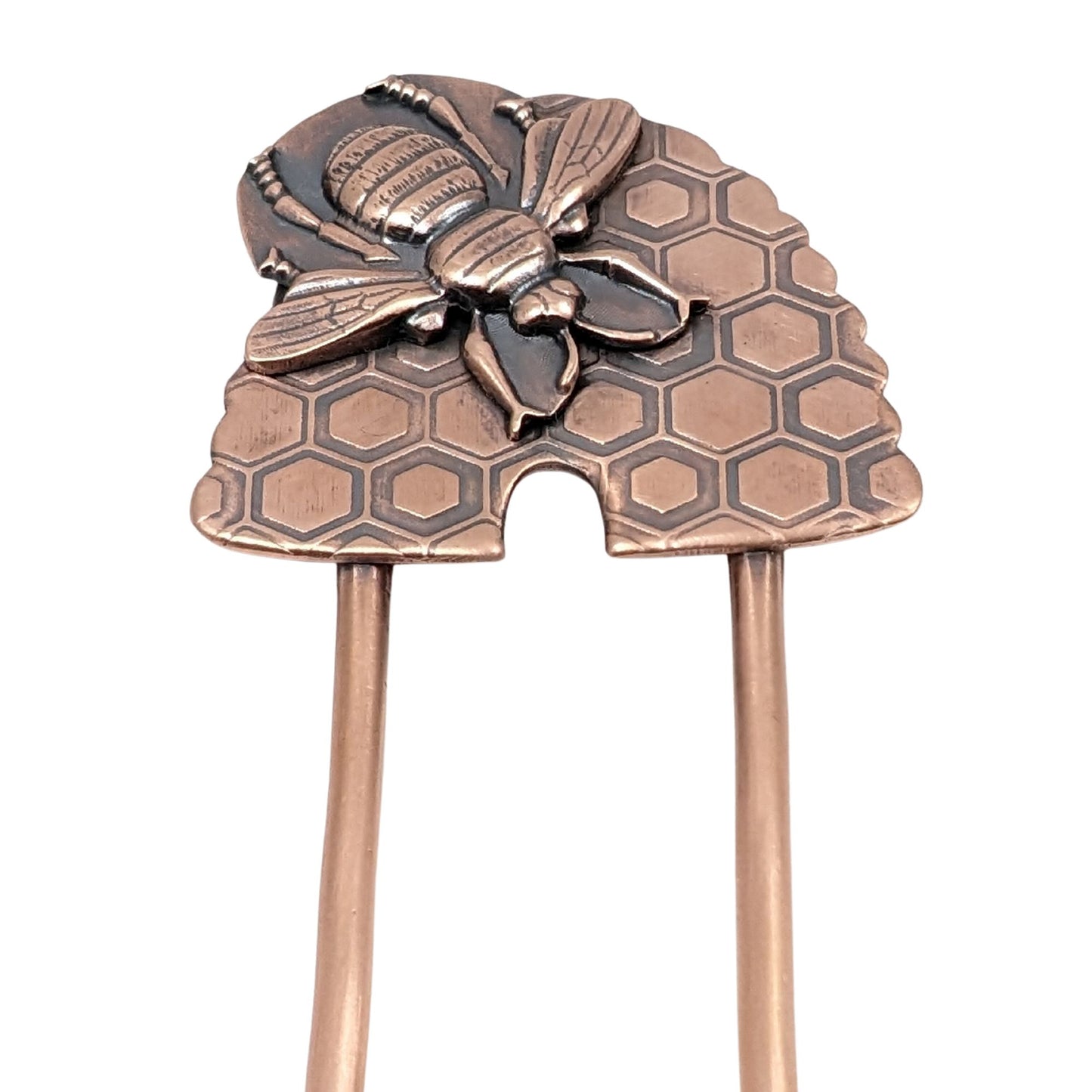 Copper Hair Fork with Bee and Beehive. The large beehive has a honeycomb design and the bee is very detailed and large enough to cover most of the hive. Recessed areas are darkened to highlight the details.