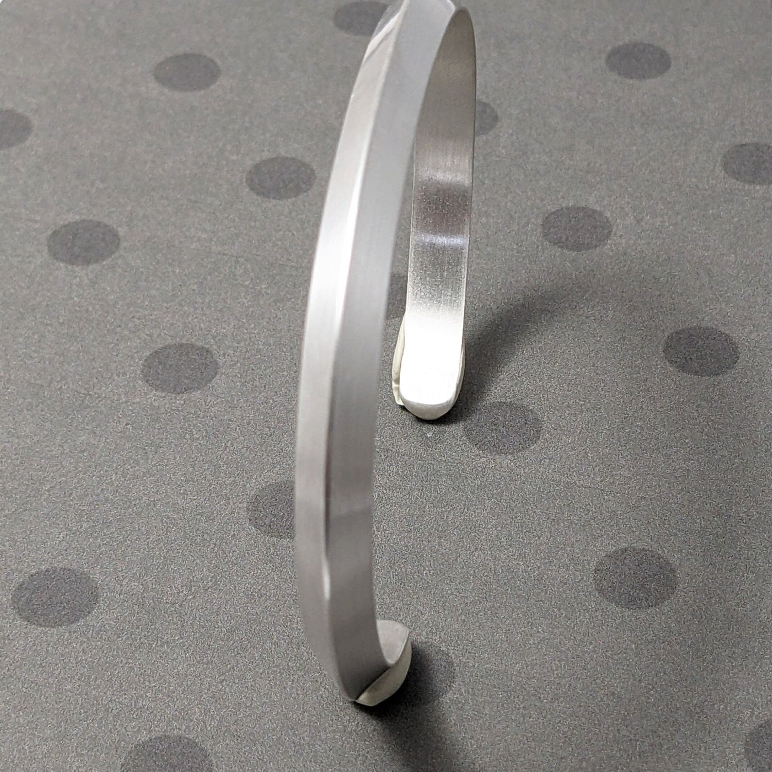 Mens sterling silver cuff bracelet made with heavy triangle shaped wire