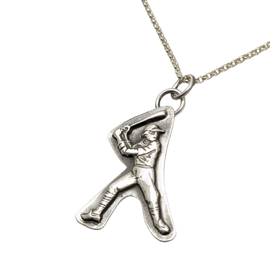 Silver pendant of a baseball player in a batter's stance on a chain