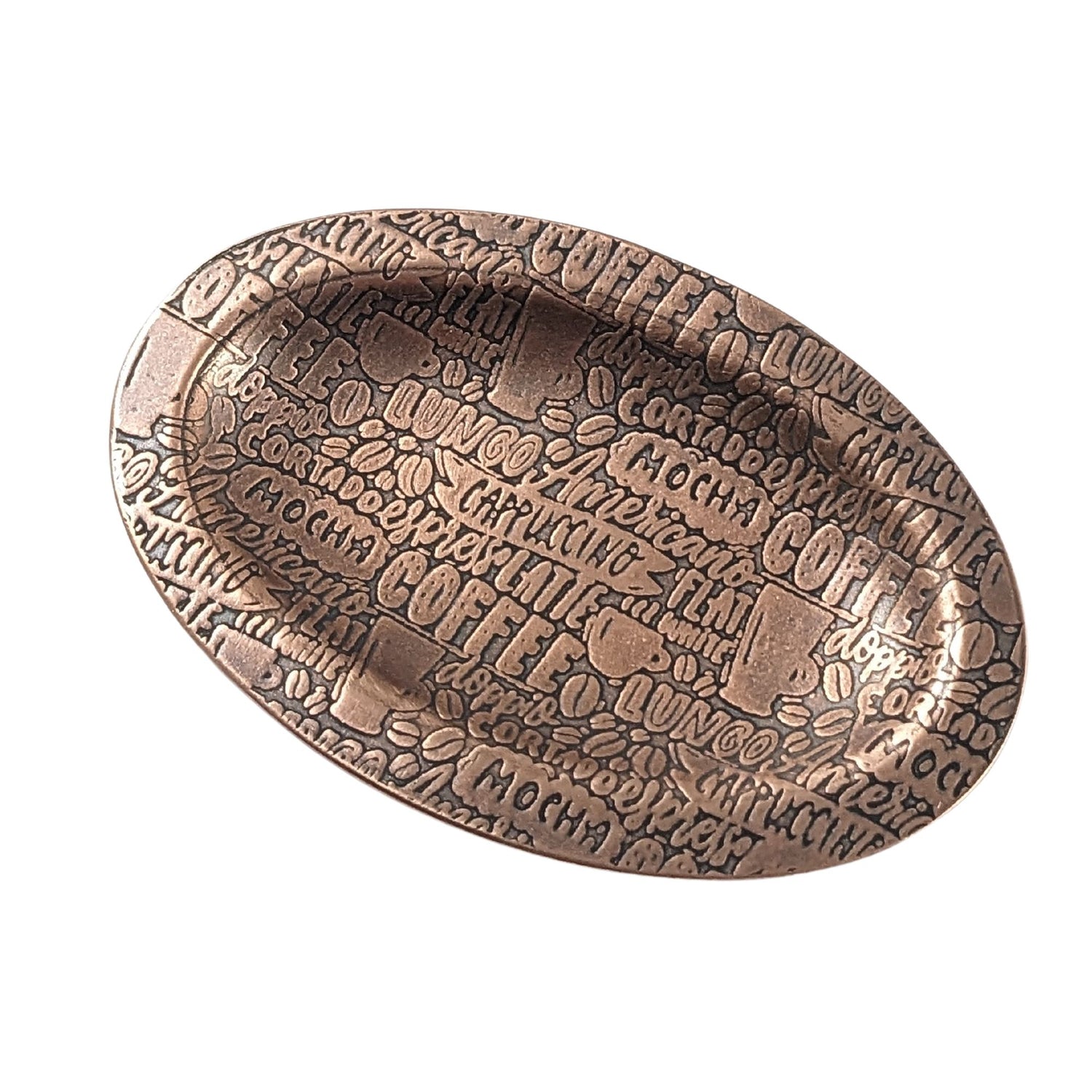 An oval copper ring dish with a raised edge. The dish has an impressed pattern of coffee order names.