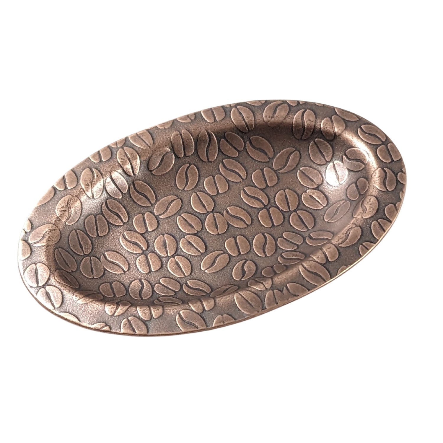 An oval copper ring dish with a raised edge. The dish has an impressed pattern of coffee beans.