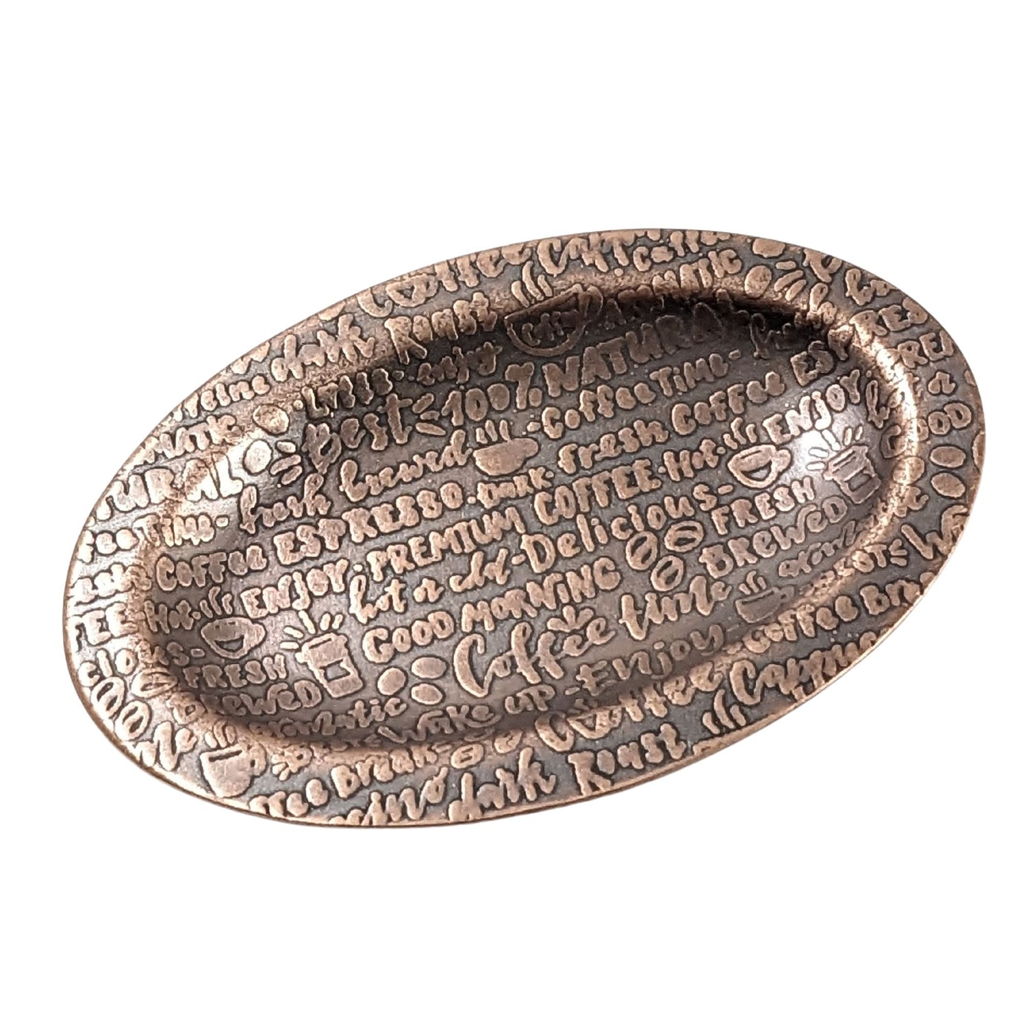 An oval copper ring dish with a raised edge. The dish has an impressed words that describe coffee like premium, good morning, wake up, fresh brewed, expresso, and more.
