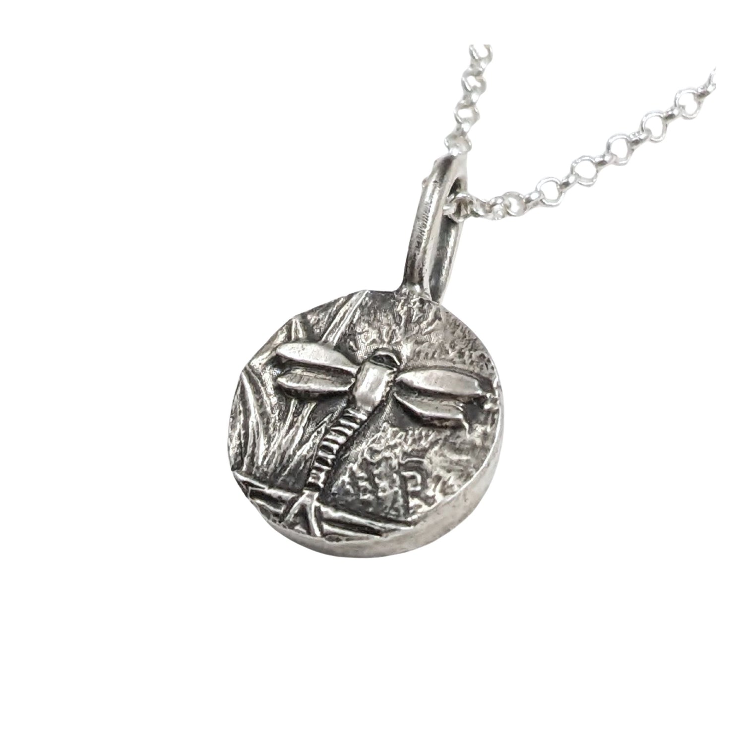 Round sterling silver pendant with dragonfly design