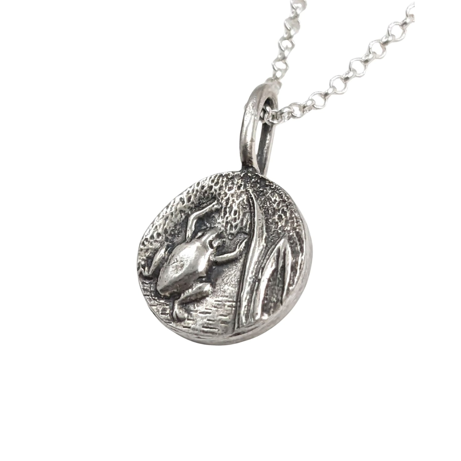 Round sterling silver pendant with frog  design