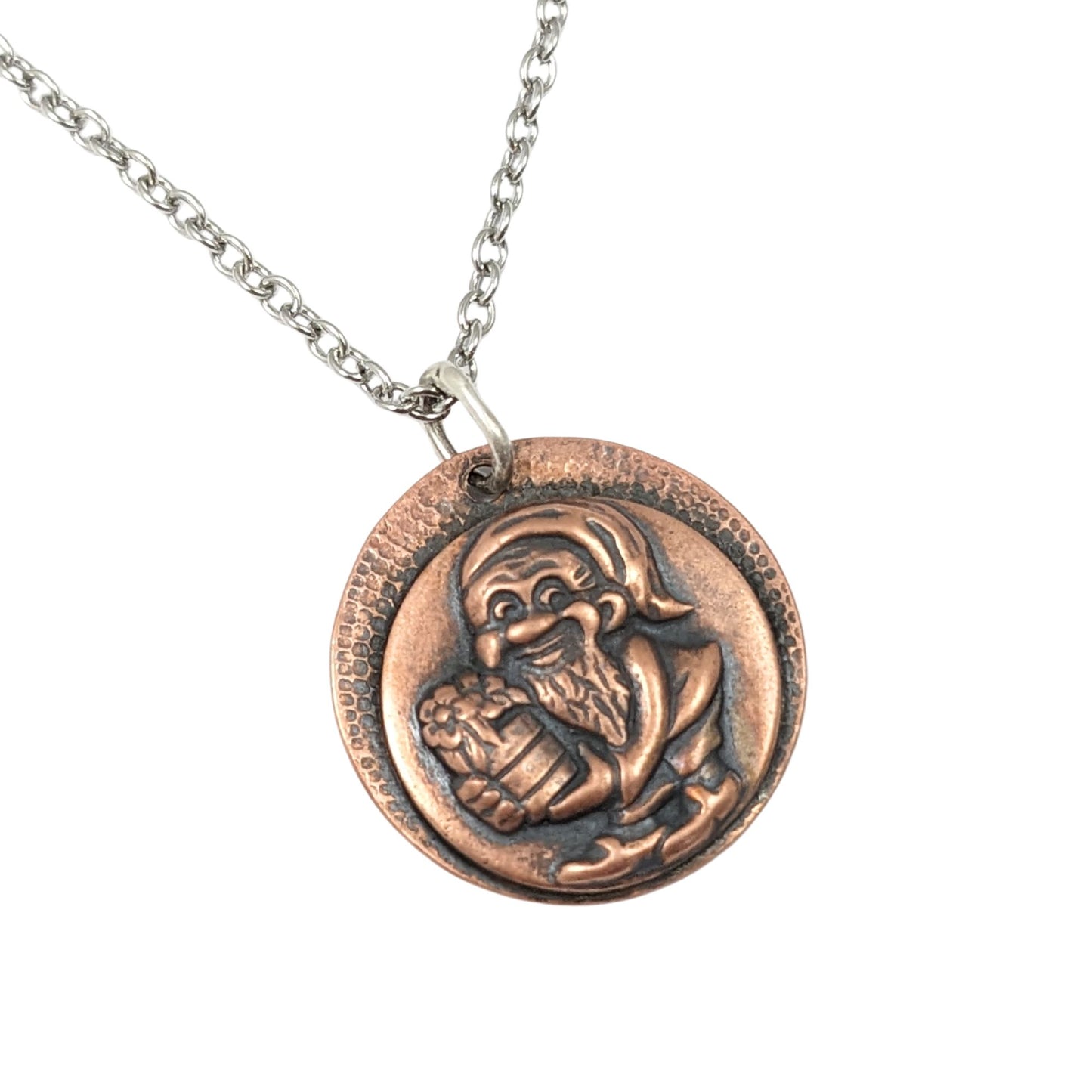 copper pendant with a garden gnome holding a barrel of produce