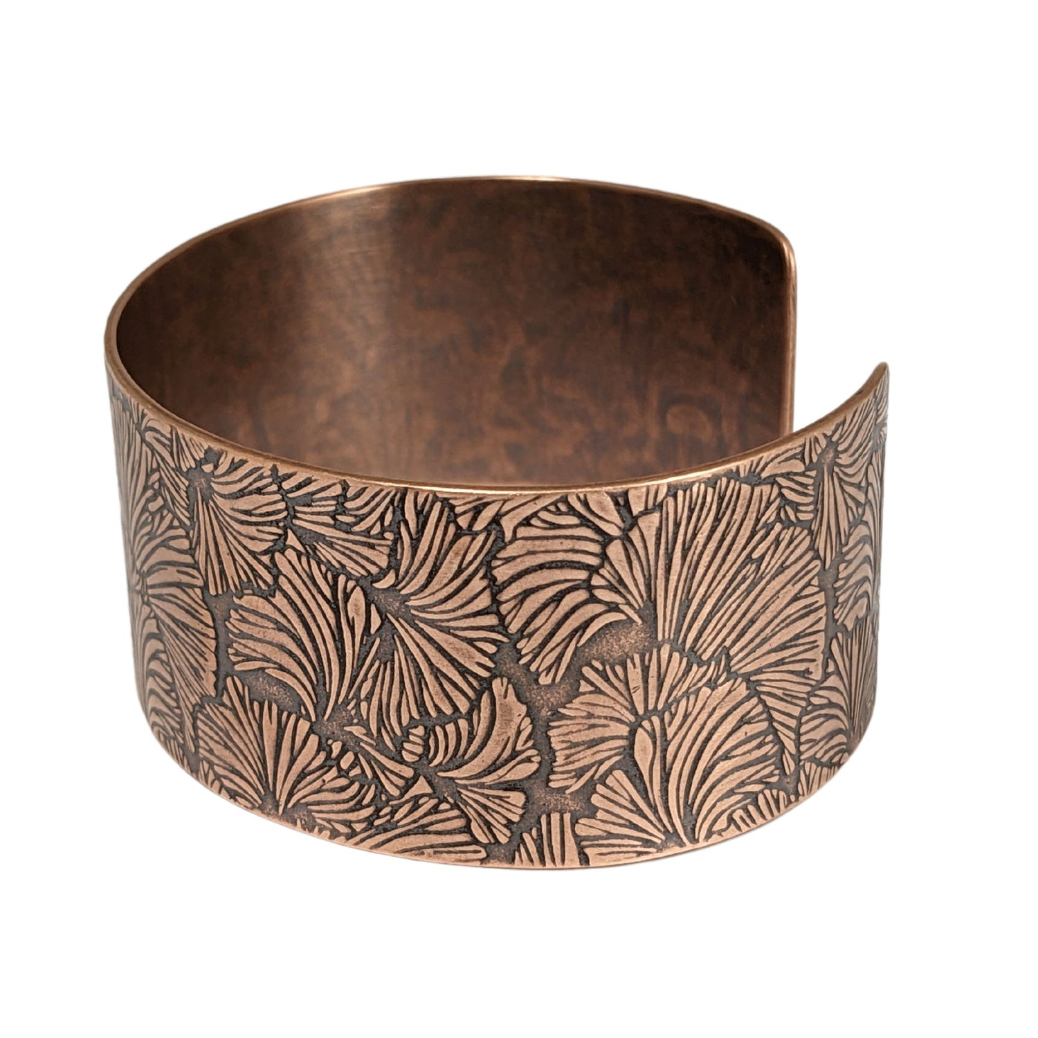 Copper cuff bracelet with a ginkgo leaf pattern design