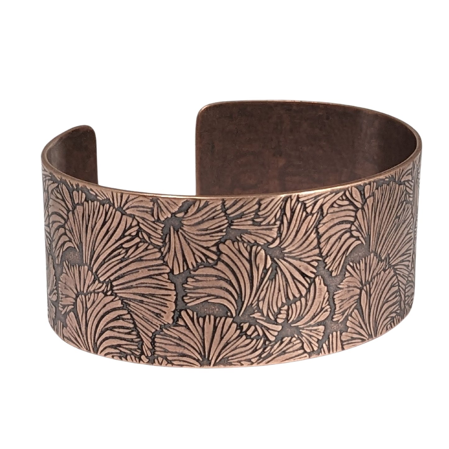 Copper cuff bracelet with a ginkgo leaf pattern design