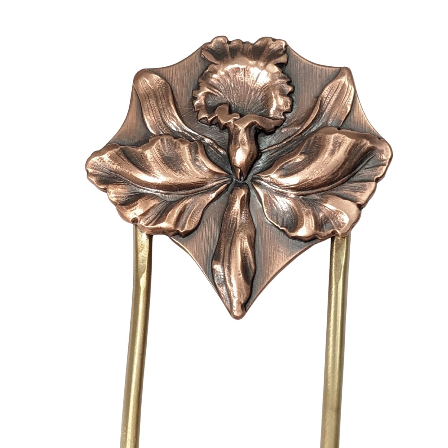 Large detailed iris in copper on a brass hair fork.
