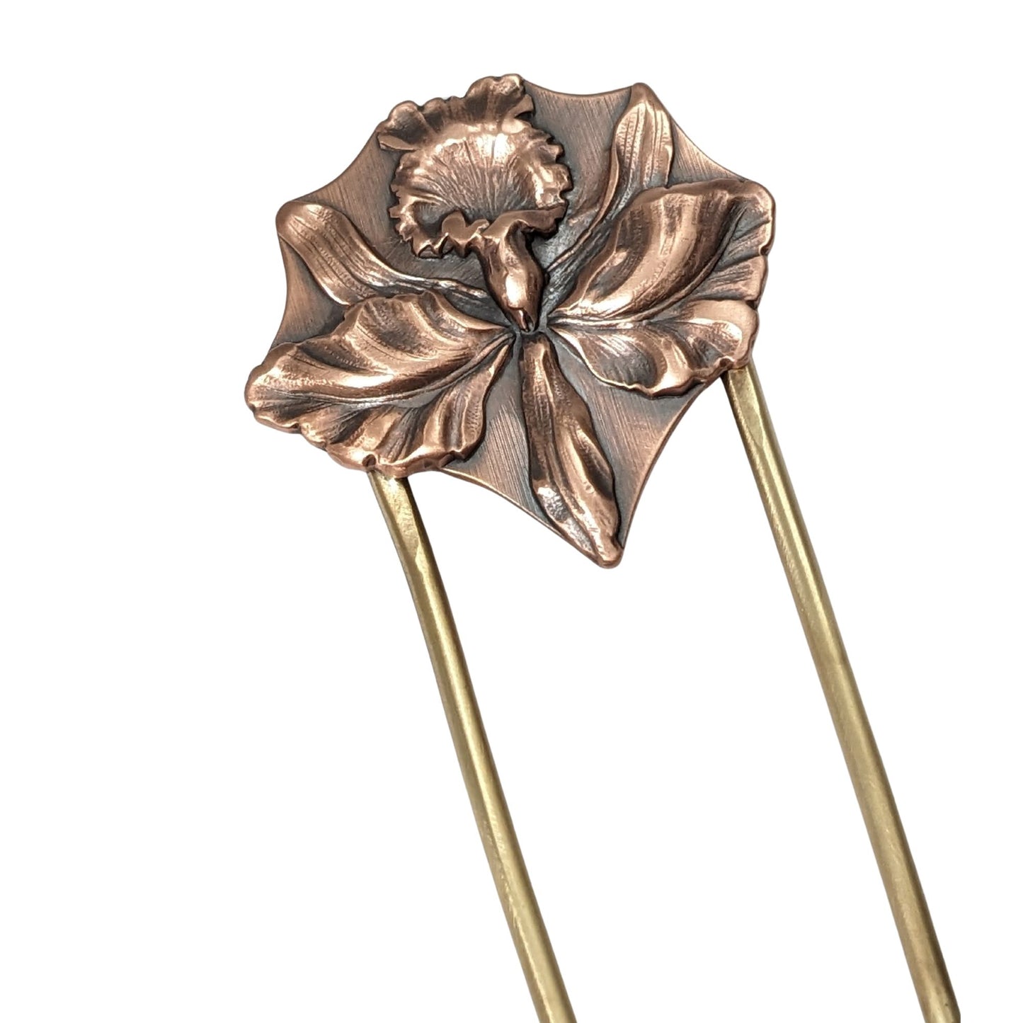 Large detailed iris in copper on a brass hair fork.
