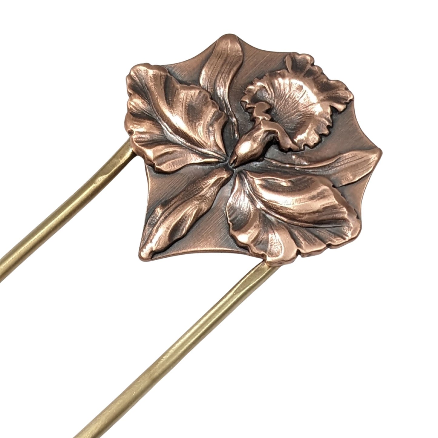 Large detailed iris in copper on a brass hair fork.