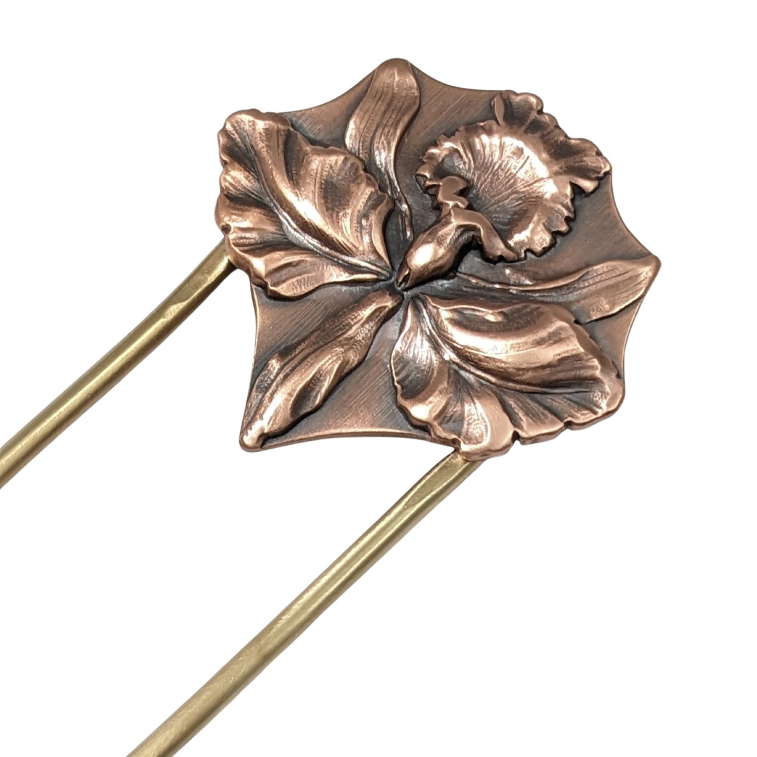 Large detailed iris in copper on a brass hair fork.