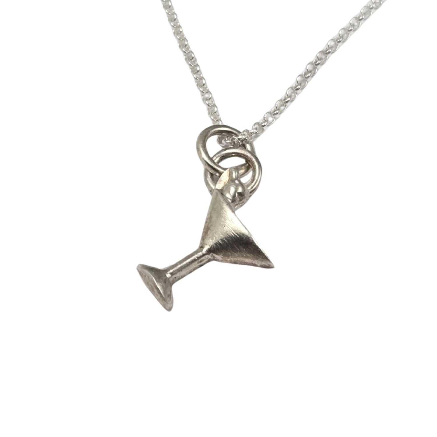 Silver martini glass pendant on a chain against a white background