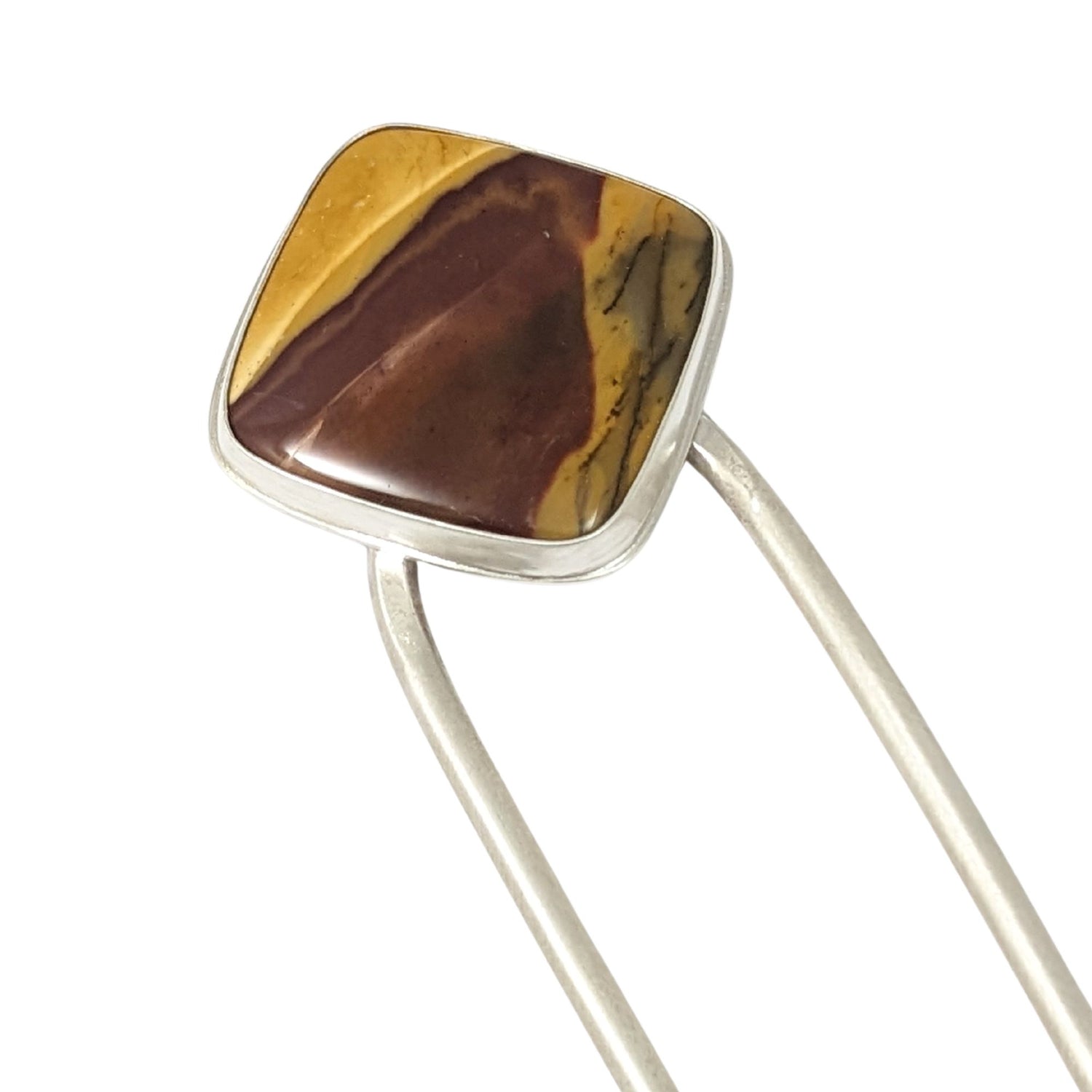 Silver hair fork with a large square red and orangish-yellow cabochon stone