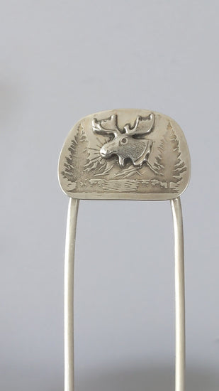 sterling silver hair fork, featuring a large and detailed moose head on a background of mountains, evergreens, and a lake.