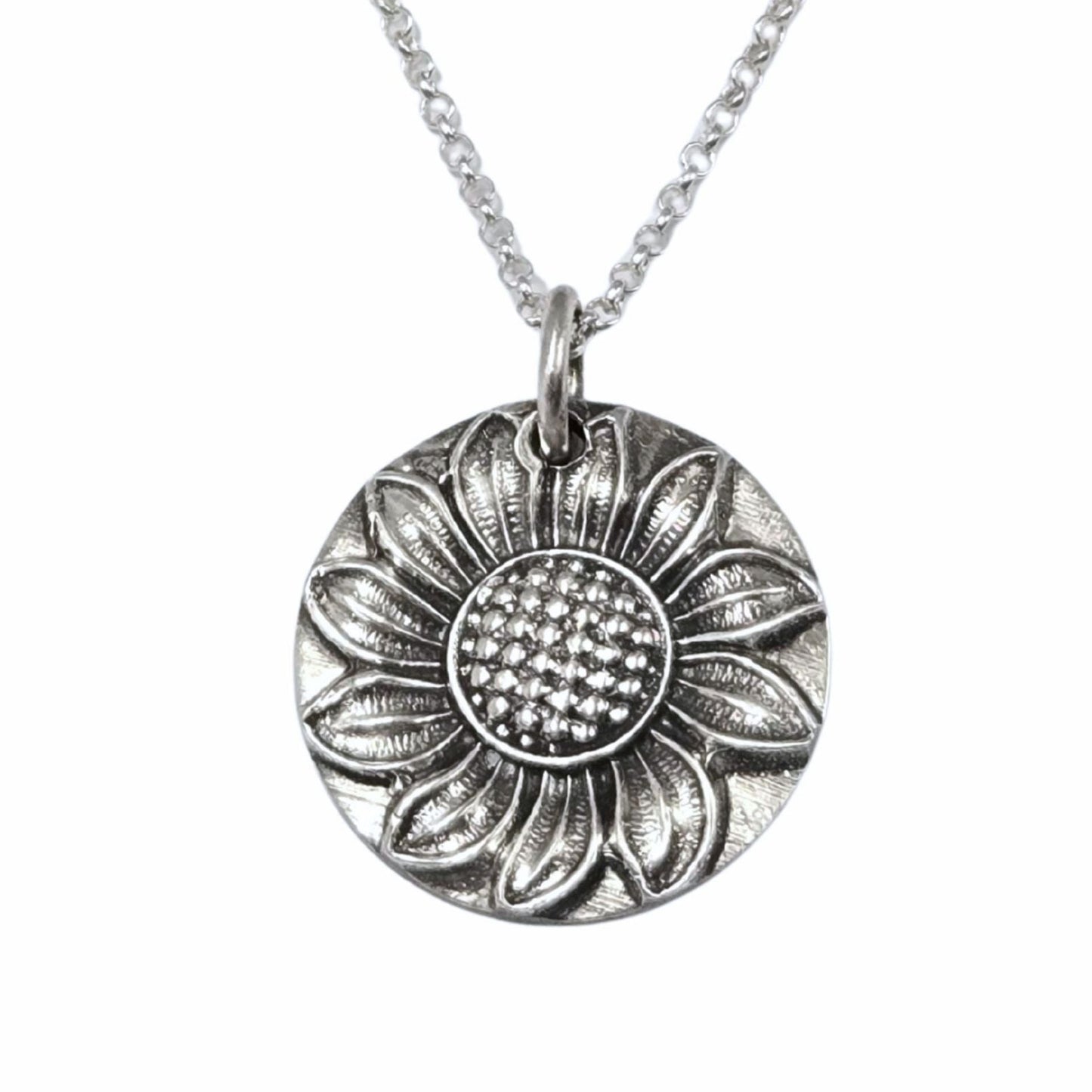 Silver sunflower pendant necklace on a white background
