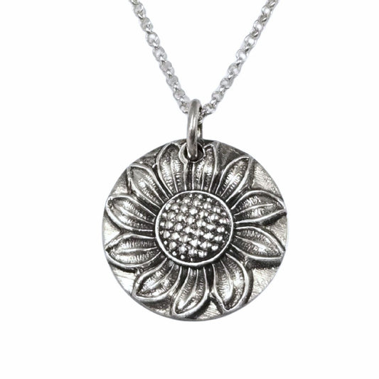 Silver sunflower pendant necklace on a white background