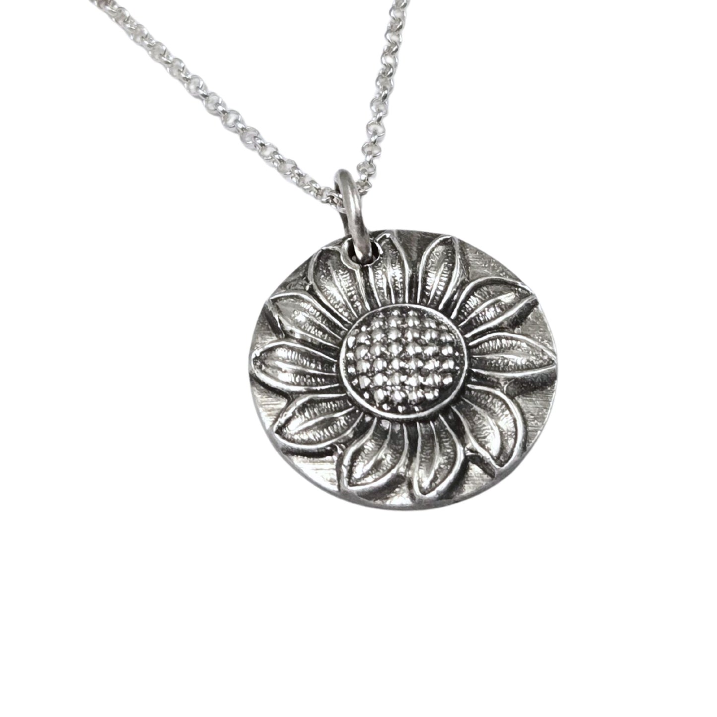 Silver sunflower pendant necklace on a white background