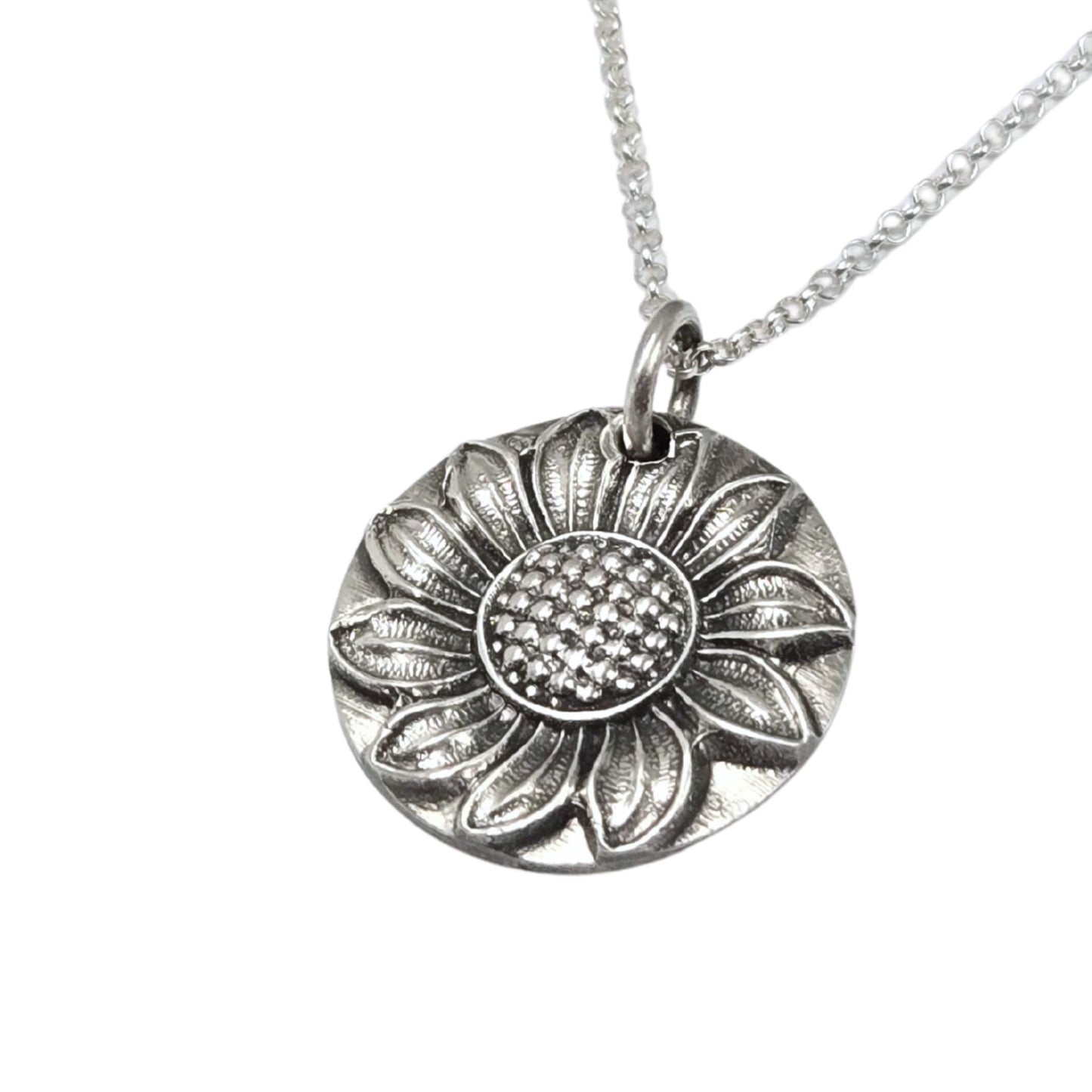 Silver sunflower pendant necklace on a white background