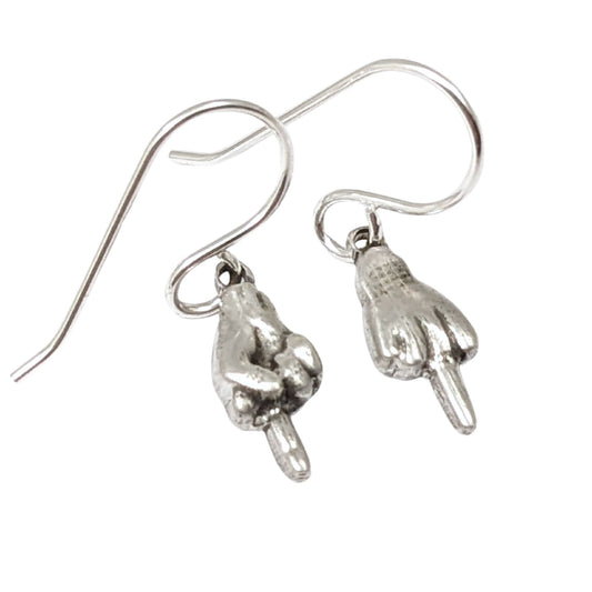 Small sterling silver earrings of hand with the middle finger raised. One hand faces forward, the other faces backward.