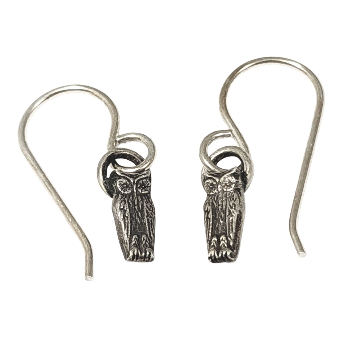Pair of silver owl earrings on a white background