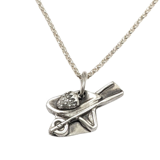 Sterling silver wheelbarrow pendant with a giant silver strawberry.