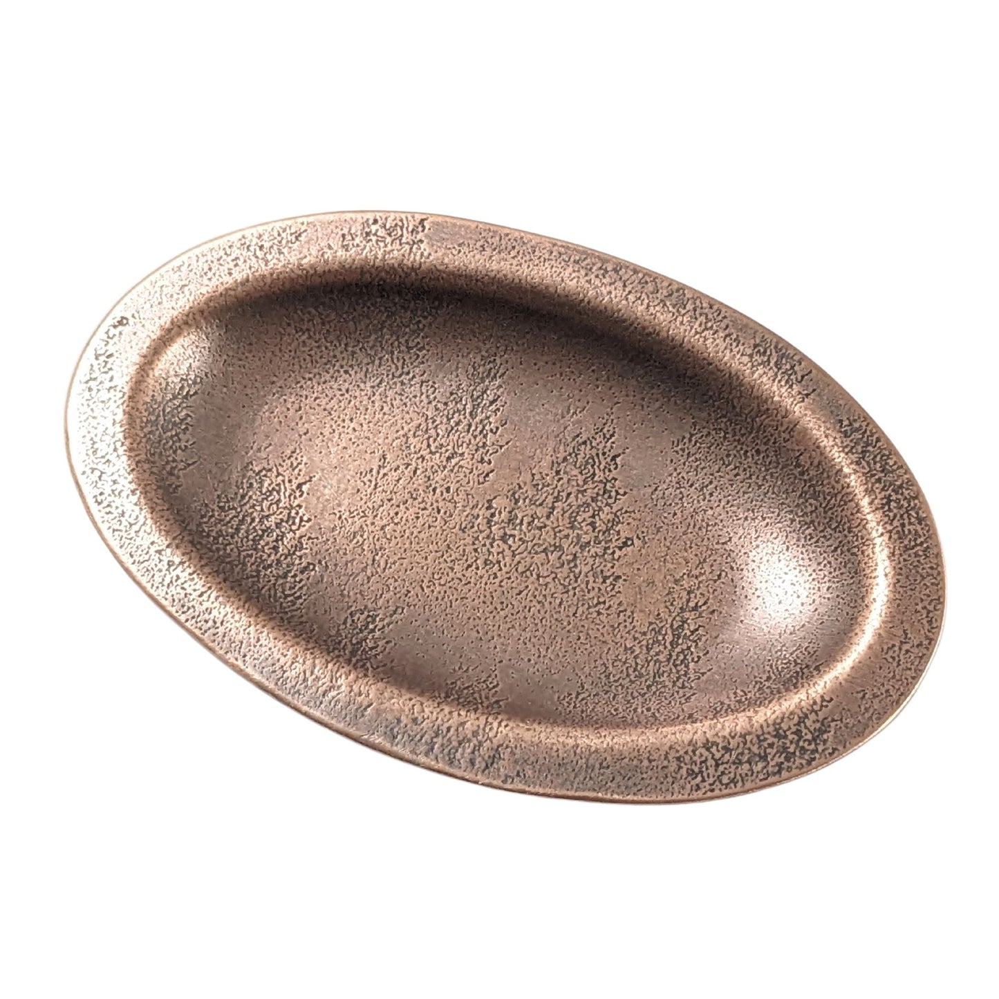 An oval copper ring dish with a raised edge. The dish has an impressed
