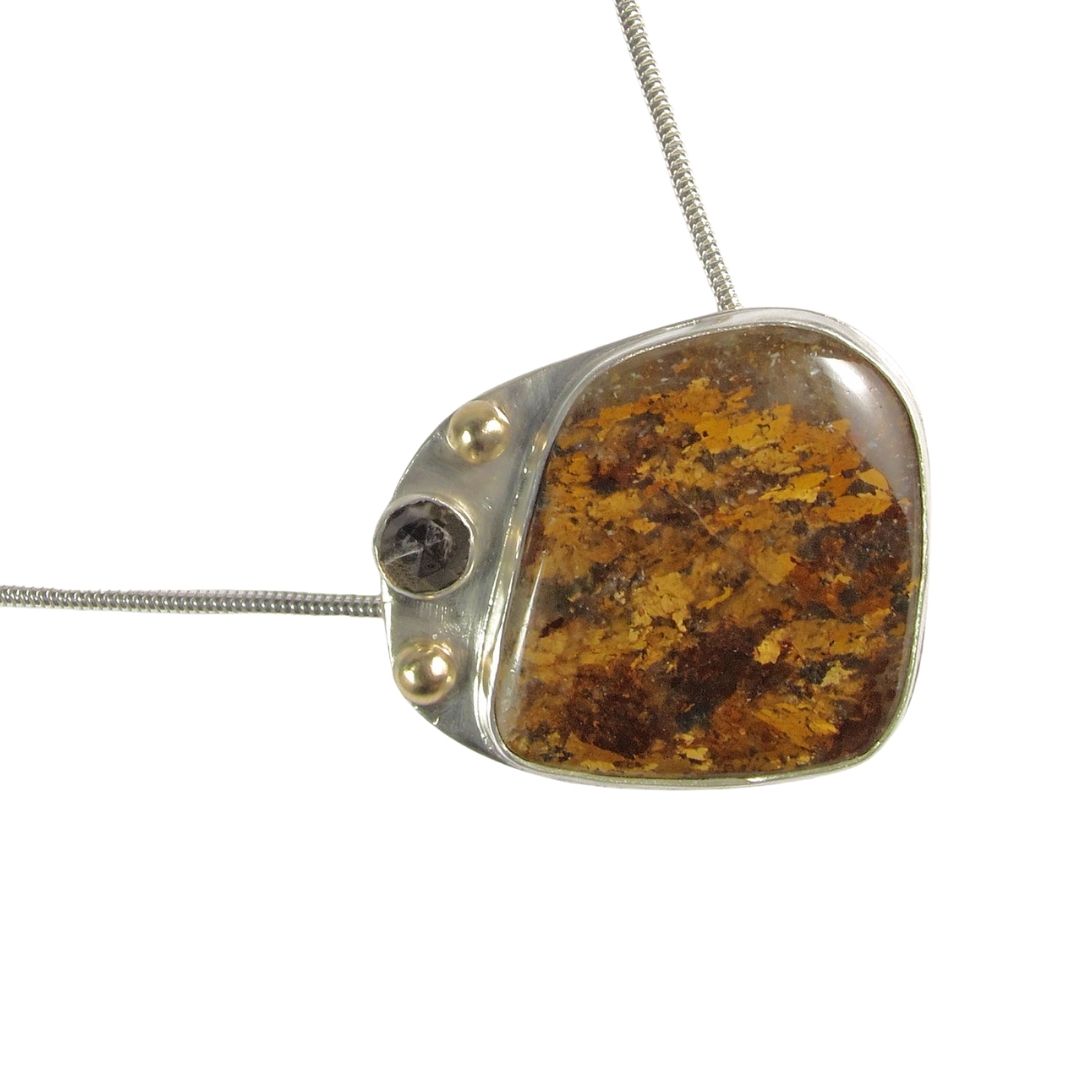 Layers of golds and browns in an Amphibole pendant sterling silver with 14K gold accents.