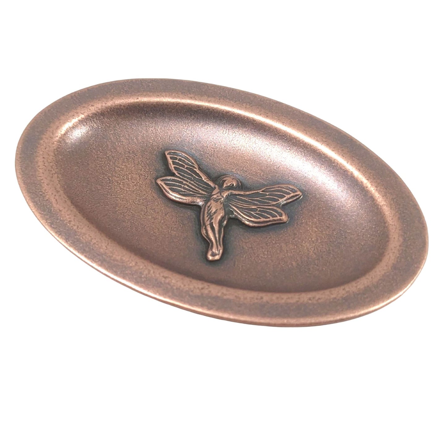 Oval copper ring dish. In the middle is a three dimensional fairy in flight. Her wings have detailed webbing pattern and you can see the draping on her dress.  The dish has a small lip around the edge.