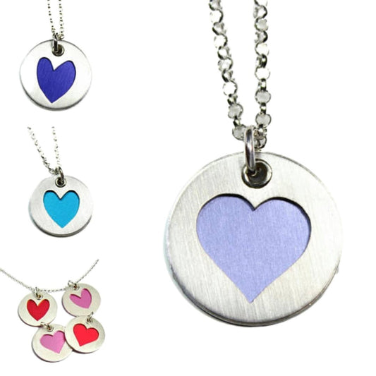 Collection of sterling silver heart charms for bracelets and necklaces. Shown in blue, turquoise, red, pink, and lavender.
