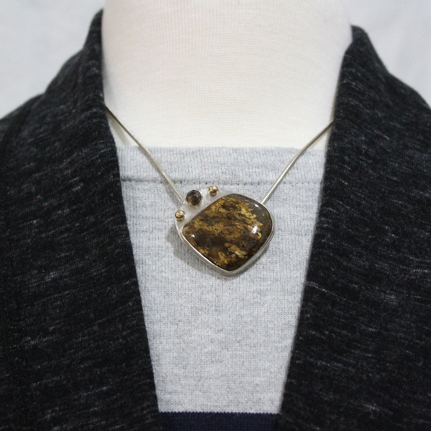 amphibole brown handmade sterling silver pendant with gold accents