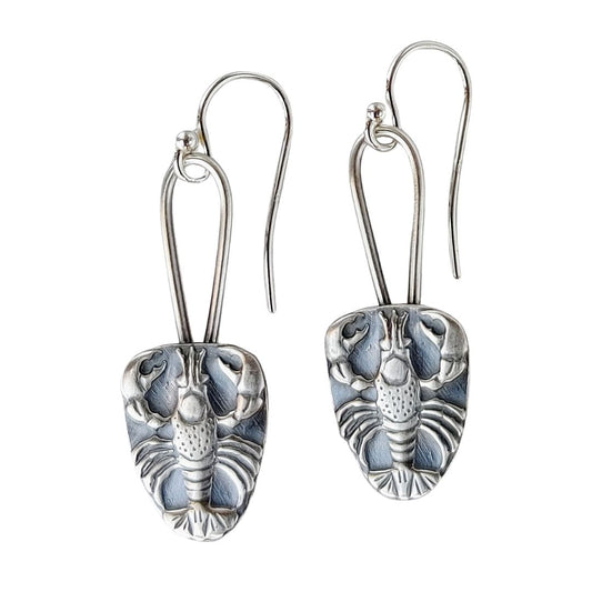Sterling silver earrings .Raised impression of a lobster on a long oval wire.